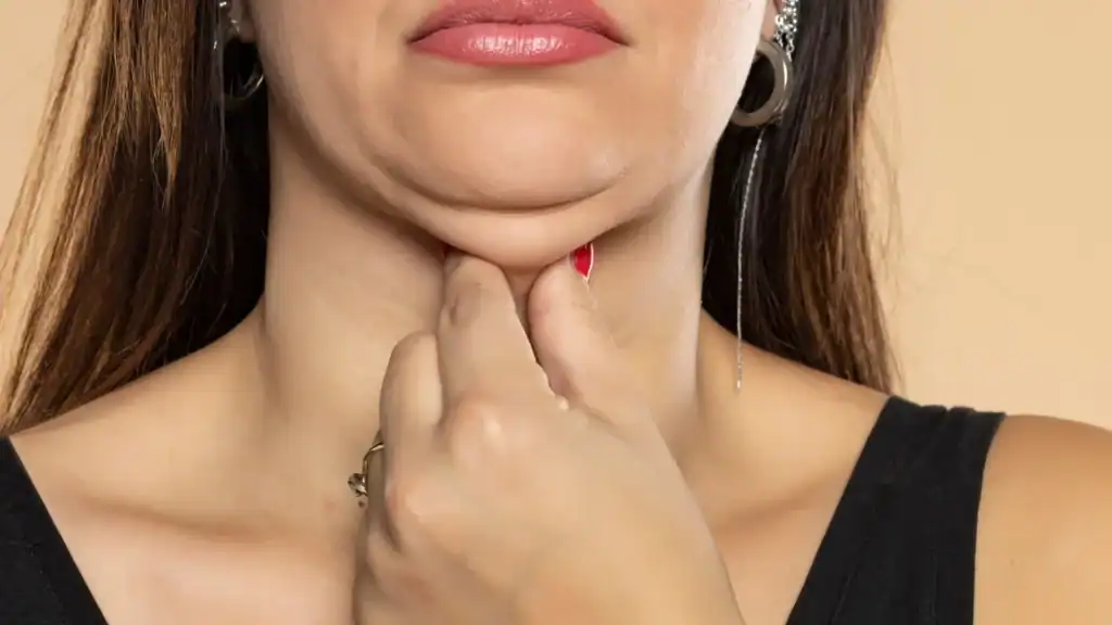 An image of a woman with double chin, sad, worried : Non Surgical Double Chin Removal Treatment in Welford on Avon, UK
